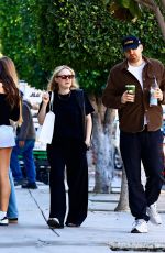 DAKOTA FANNING Out Shopping on Melrose Place with David Bernard 01/02/2025