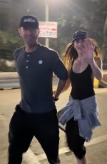 DAKOTA JOHNSON and Chris Martin Out in Mumbai 01/17/2025