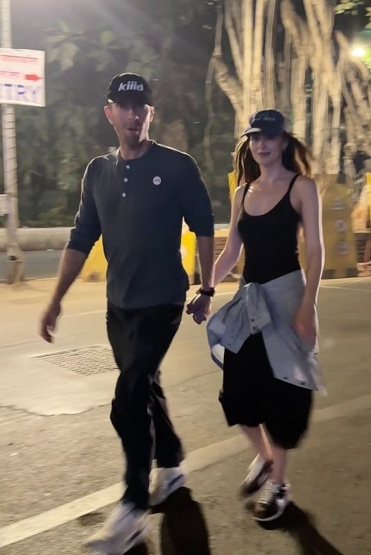 DAKOTA JOHNSON and Chris Martin Out in Mumbai 01/17/2025