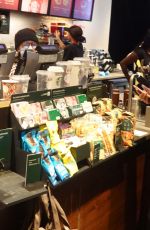 KATIE HOLMES Grabbing a Coffee at Starbucks at Times Square in New York 12/02/2024