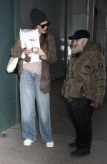 KATIE HOLMES Greeting Radio Man During an Outing in New York City 01/12/2025