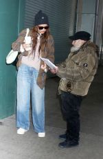KATIE HOLMES Greeting Radio Man During an Outing in New York City 01/12/2025