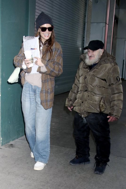 KATIE HOLMES Greeting Radio Man During an Outing in New York City 01/12/2025