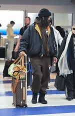 MADONNA and Akeem Morris Arrives at JFK Airport in New York City 01/07/2025