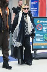 MADONNA and Akeem Morris Arrives at JFK Airport in New York City 01/07/2025