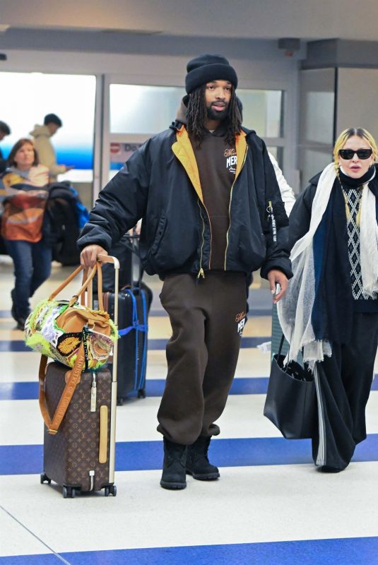 MADONNA and Akeem Morris Arrives at JFK Airport in New York City 01/07/2025