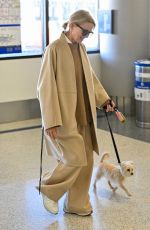 NAOMI WATTS Arrives at Los Angeles International Airport with Her Dog 01/12/2025
