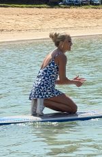CARRIE UNDERWOOD Paddle Boarding in Hawaii 02/14/2025