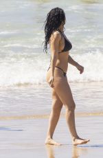 CHARLI XCX in a Black Bikini at a Beach in Byron Bay 02/10/2025