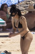 CHARLI XCX in a Black Bikini at a Beach in Byron Bay 02/10/2025