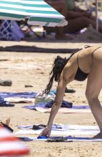 CHARLI XCX in a Black Bikini at a Beach in Byron Bay 02/10/2025
