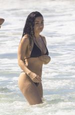 CHARLI XCX in a Black Bikini at a Beach in Byron Bay 02/10/2025