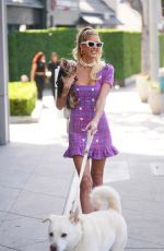 EMMA HERNAN Takes Her Dogs for a Walk Outside Oppenheim Group Office in West Hollywood 02/18/2025