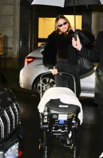 HAILEY BIEBER Out with Baby and Assistant on Rainy City Night 01/31/2025