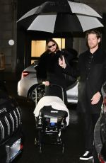 HAILEY BIEBER Out with Baby and Assistant on Rainy City Night 01/31/2025