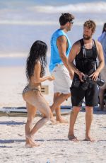 KIM KARDASHIAN in a Zebra Animal Print Bikini at a Beach Photoshoot in Bahamas 02/19/2025