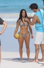 KIM KARDASHIAN in a Zebra Animal Print Bikini at a Beach Photoshoot in Bahamas 02/19/2025