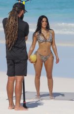 KIM KARDASHIAN in a Zebra Animal Print Bikini at a Beach Photoshoot in Bahamas 02/19/2025