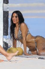 KIM KARDASHIAN in a Zebra Animal Print Bikini at a Beach Photoshoot in Bahamas 02/19/2025