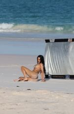 KIM KARDASHIAN in Bikini at a Photoshoot on the Beach in Los Angeles 02/18/2025