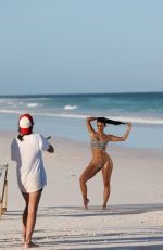 KIM KARDASHIAN in Bikini at a Photoshoot on the Beach in Los Angeles 02/18/2025