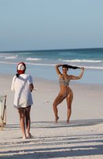 KIM KARDASHIAN in Bikini at a Photoshoot on the Beach in Los Angeles 02/18/2025