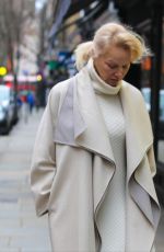 PAMELA ANDERSON in All White Retori Outfit and Vintage Prada Shoes Promotes The Last Showgirl in London 02/17/2025
