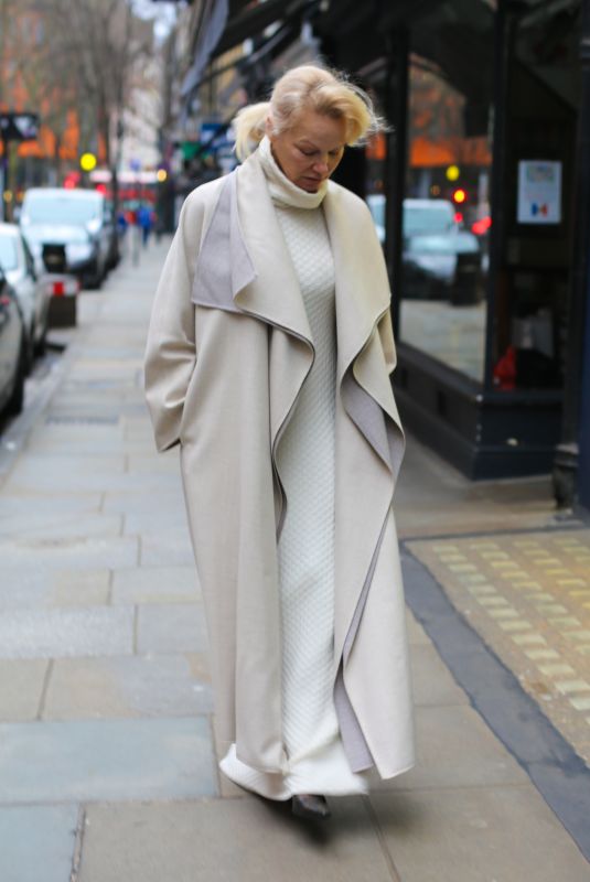 PAMELA ANDERSON in All White Retori Outfit and Vintage Prada Shoes Promotes The Last Showgirl in London 02/17/2025