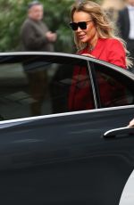 AMANDA HOLDEN in Red Trouser Suit Leaves Heart Radio Studios 03/27/2025