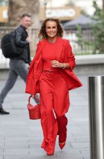 AMANDA HOLDEN in Red Trouser Suit Leaves Heart Radio Studios 03/27/2025