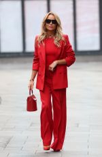 AMANDA HOLDEN in Red Trouser Suit Leaves Heart Radio Studios 03/27/2025