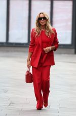 AMANDA HOLDEN in Red Trouser Suit Leaves Heart Radio Studios 03/27/2025