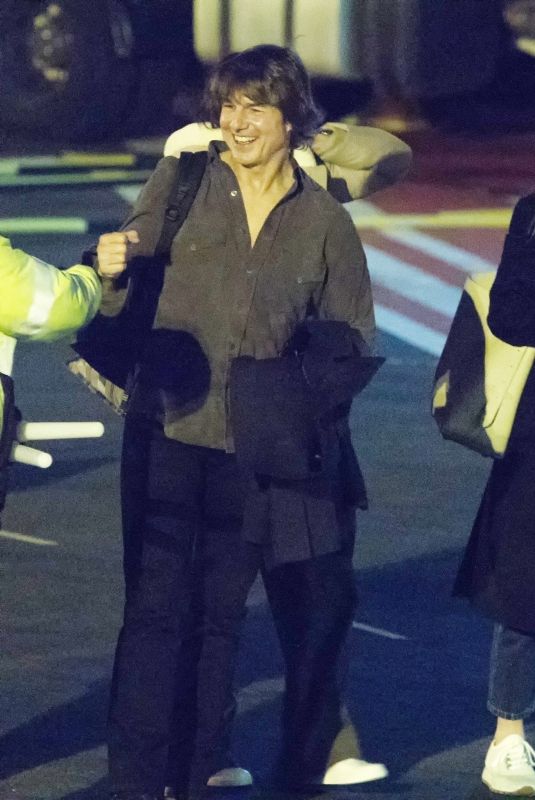 ANA DE ARMAS and Tom Cruise at London Heliport Battersea in London 03/14/2025
