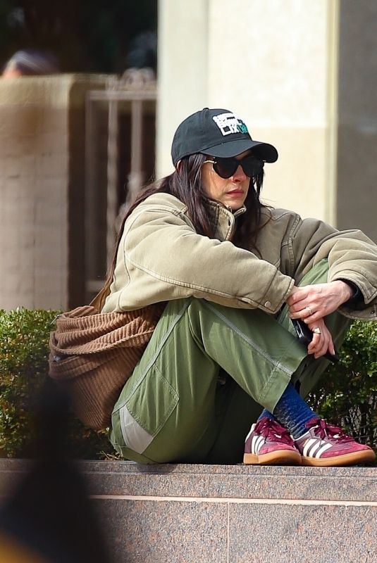 ANNE HATHAWAY Sitting on a Small Fence 03/12/2025