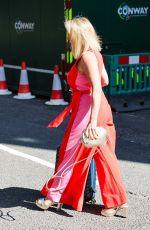 CLAIRE SWEENEY in a Belted Orange Jumpsuit Arrives at Vanessa Show 03/27/2025