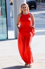 CLAIRE SWEENEY in a Belted Orange Jumpsuit Arrives at Vanessa Show 03/27/2025