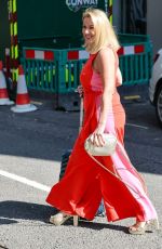 CLAIRE SWEENEY in a Belted Orange Jumpsuit Arrives at Vanessa Show 03/27/2025