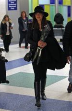 DAKOTA JOHNSON Arrives at JFK Airport in New York 02/14/2025