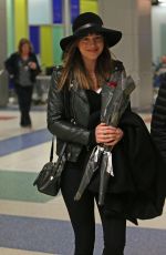 DAKOTA JOHNSON Arrives at JFK Airport in New York 02/14/2025