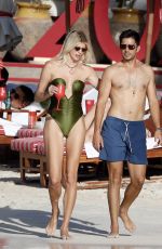 DEVON WINDSOR in Swimsuit at a Beach in St Barts 03/27/2025