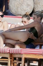 DEVON WINDSOR in Swimsuit at a Beach in St Barts 03/27/2025