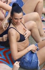 DUA LIPA Enjoying a Beach Day in Sydney 03/30/2025