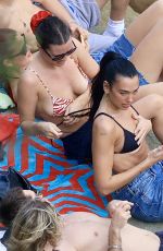 DUA LIPA Enjoying a Beach Day in Sydney 03/30/2025