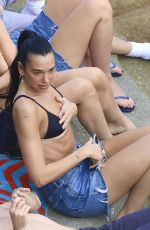 DUA LIPA Enjoying a Beach Day in Sydney 03/30/2025