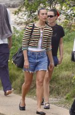 DUA LIPA Enjoying a Beach Day in Sydney 03/30/2025