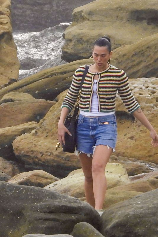 DUA LIPA Enjoying a Beach Day in Sydney 03/30/2025