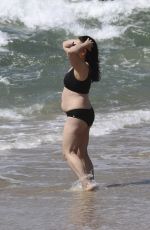 ELIZABETH REGAL in a Black Bikini at Hermosa Beach 03/21/2025