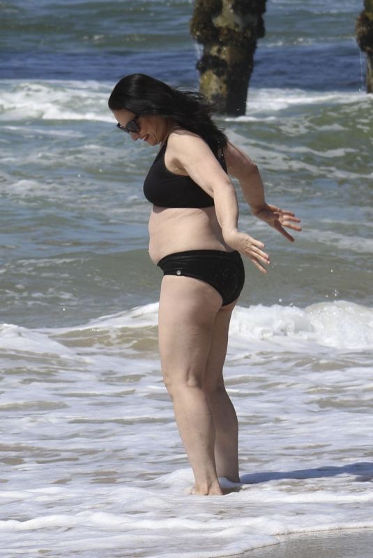ELIZABETH REGAL in a Black Bikini at Hermosa Beach 03/21/2025