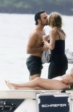GISELE BUNDCHE in Swimsuit and Joaquim Valente at a Boat Ride with Friends in Miami 03/15/2025