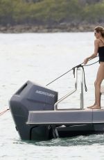 GISELE BUNDCHE in Swimsuit and Joaquim Valente at a Boat Ride with Friends in Miami 03/15/2025